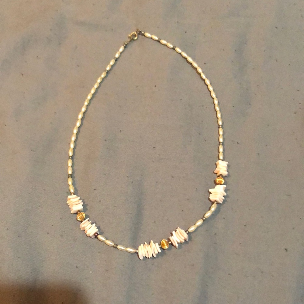 Shell necklace with gold accents